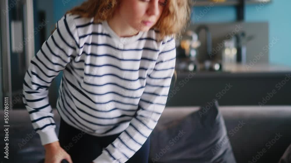 Caucasian woman has a heart attack vacuuming floor in her apartment. Adult female vacuum-cleaning the rug feels pain in her chest. Housewife cleans up the mess in the room experiences pain in heart