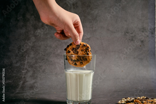 a glass of milk and cookies with chocolate