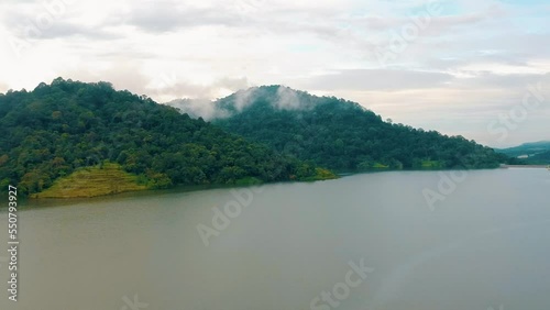 Mountains With Lush Rainforest In Idyllic Lake Near Semenyih In Selangor, Malaysia. Aerial Wide Shot photo