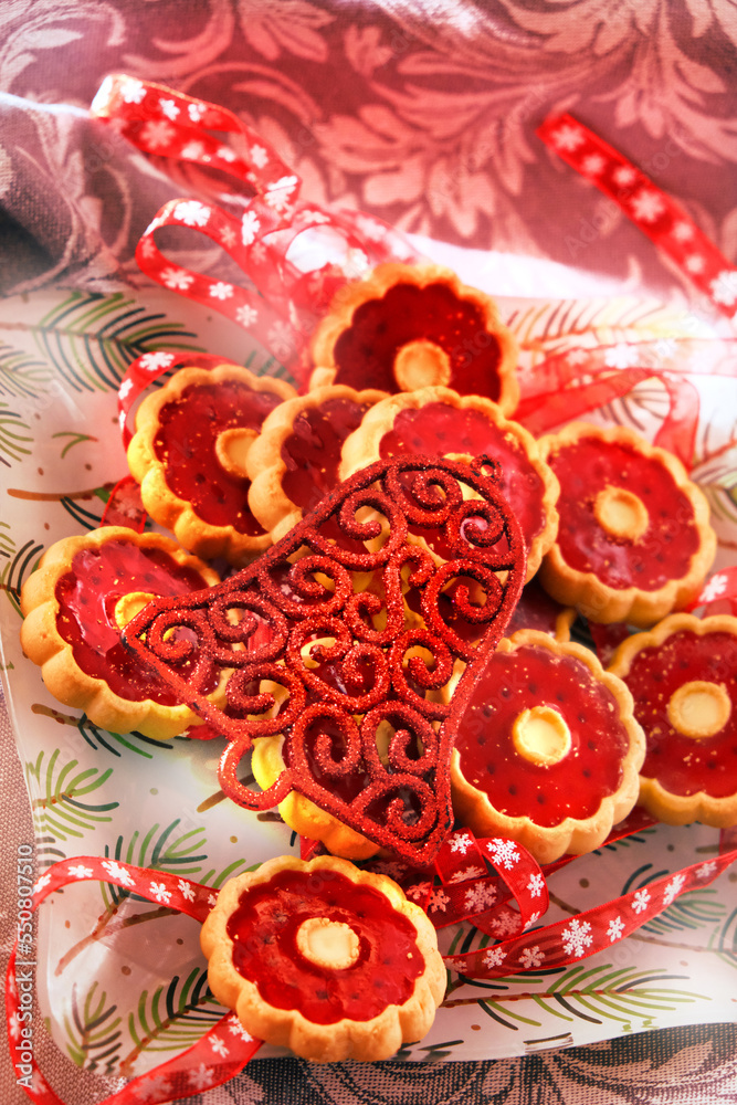 Thumbprint breakfast cookies with raspberry jam. Homemade freshly baked shortbread cookies, Christmas atmospheric mood. Happy New Year