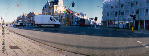 Print op canvas panoramic lowangle view on traffic passing a signalized junction on a sunny day