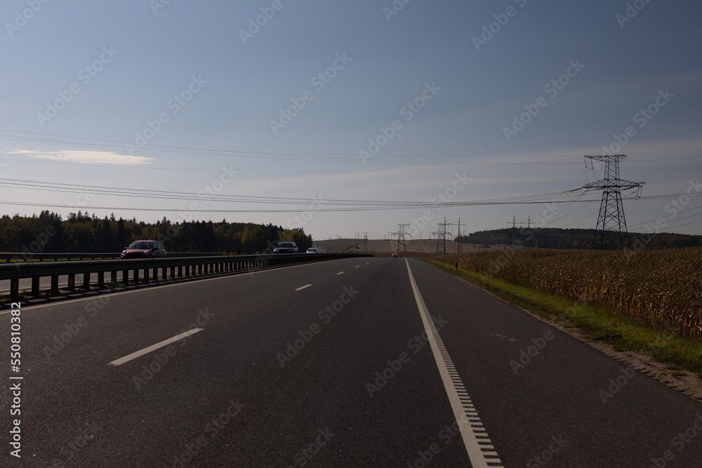 Highway wide road, transport and blue sky with clouds on a summer day Highway wide road, transport and blue sky with clouds on a summer day
