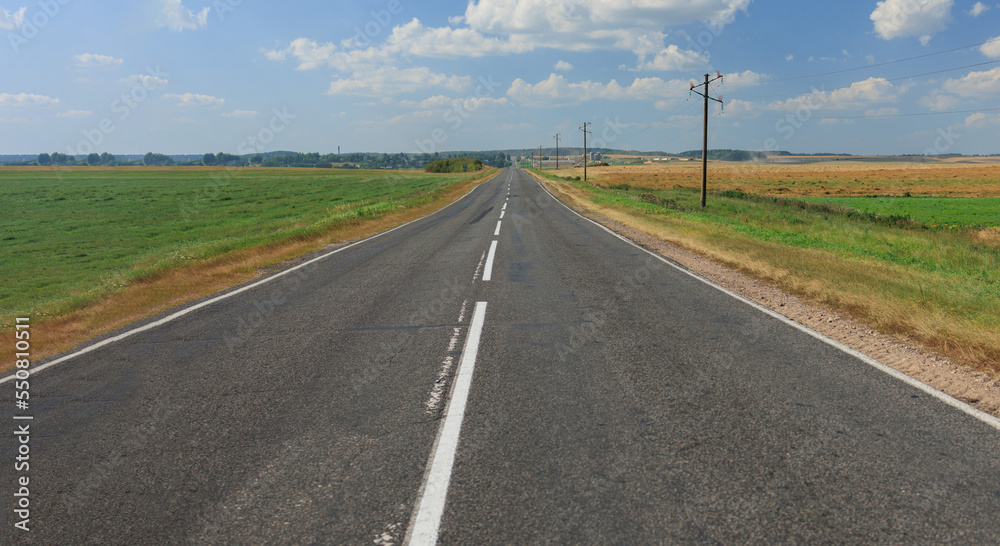 Highway wide road, transport and blue sky with clouds on a summer day