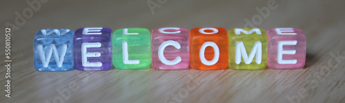 Welcome- word made from multicolored child toy cubes with letters