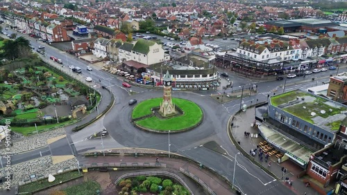 Aerial footage of the town centre of Skegness on a wet windy overcast day in November. Showing the town clock and busy main street. with people and shops. photo