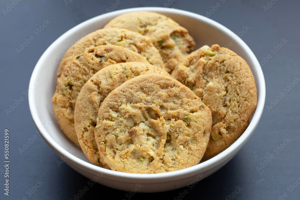 Pistachio and almond cookies on dark background. Pistachio and almond cookies on dark background.