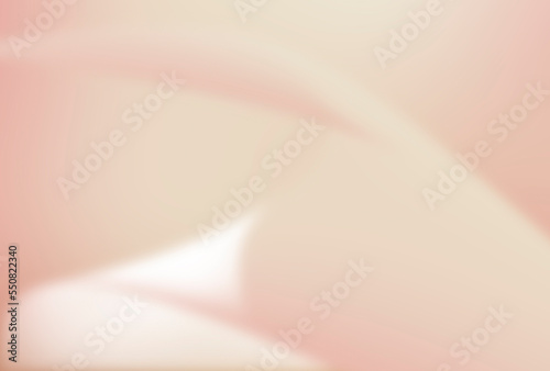 Blurred abstract curved pattern of pink and cream gradient background.