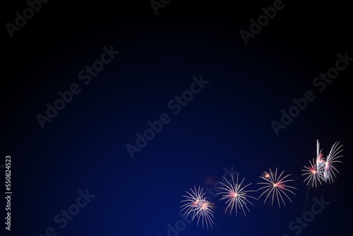 colorful fireworks display on dark blue background