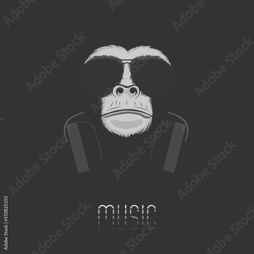 Music logo. Chimpanzee monkey in headphones and sunglasses on a black background