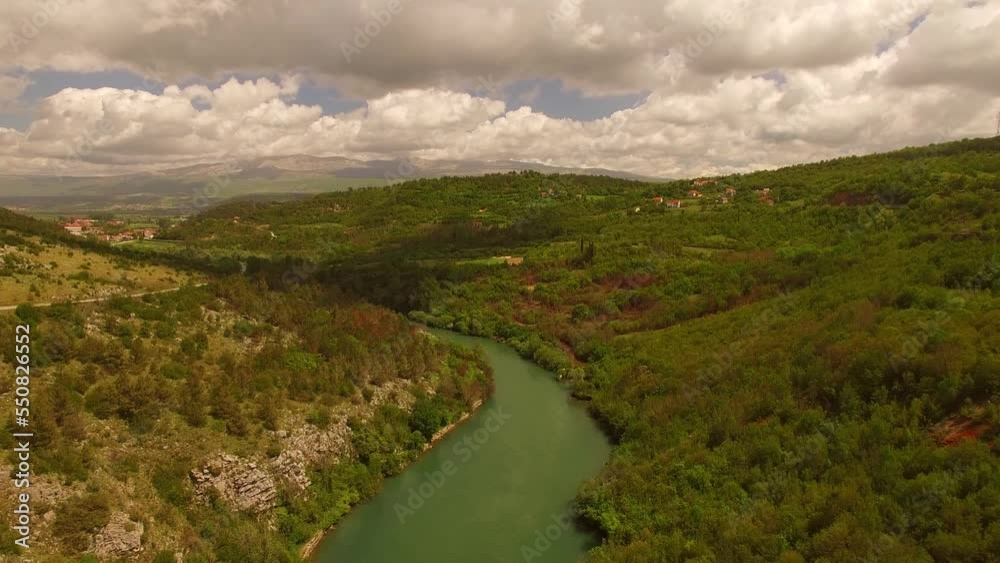 A beautiful river next to a small village. A beautiful river next to a small village.