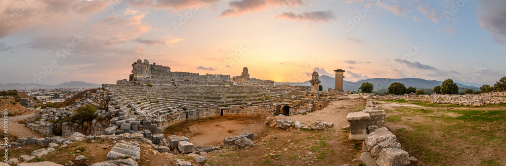 Naklejka premium Xanthos Ancient City. Grave monument and the ruins of ancient city of Xanthos - Letoon in Kas, Antalya, Turkey at sunset. Capital of Lycia.