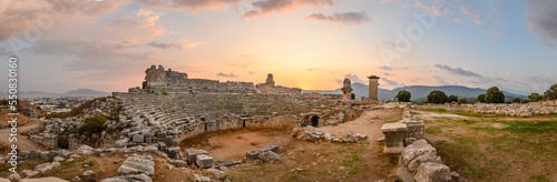 Xanthos Ancient City. Grave monument and the ruins of ancient city of Xanthos - Letoon in Kas, Antalya, Turkey at sunset. Capital of Lycia. photo
