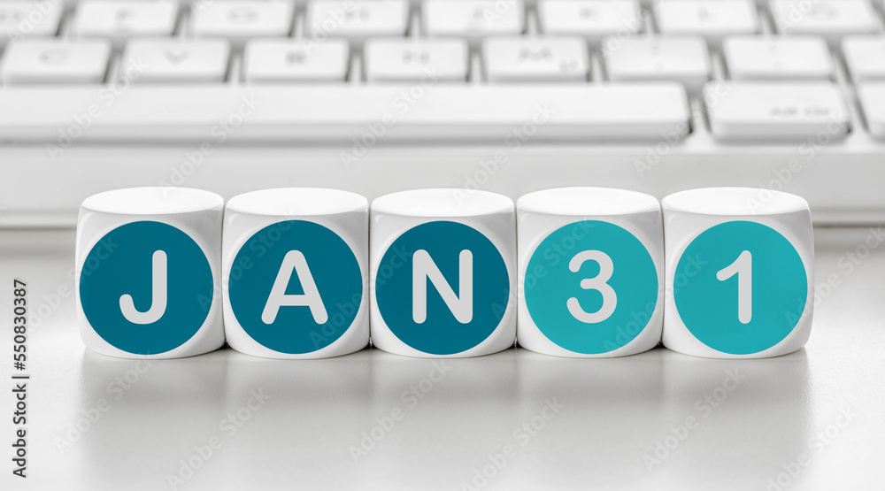 Letter dice in front of a keyboard - January 31