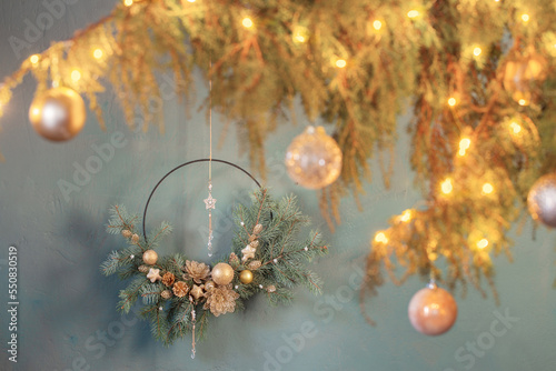 christmas decor with golden balls on background dark wall