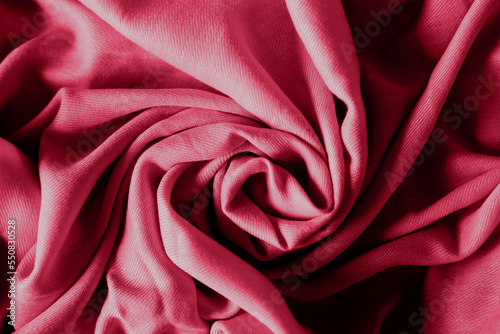 Color of the year 2023. Viva Magenta color trends. Crumpled fabric background. Abstract background.
