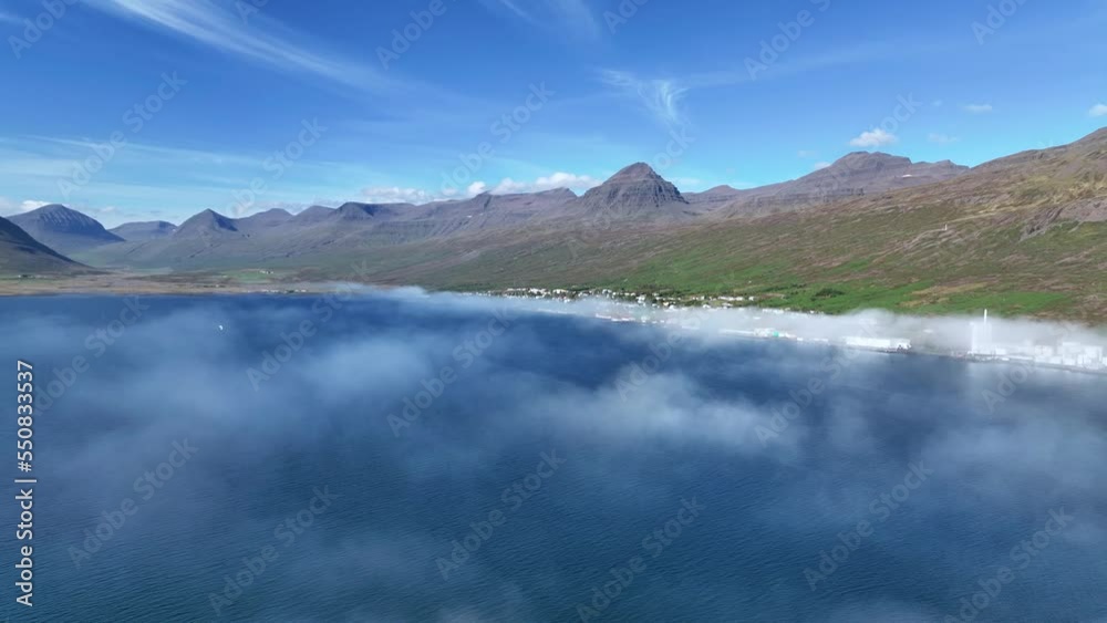Idyllic Faskrudsfjordur Fjord With Low Clouds In East Iceland - aerial drone shot Idyllic Faskrudsfjordur Fjord With Low Clouds In East Iceland - aerial drone shot