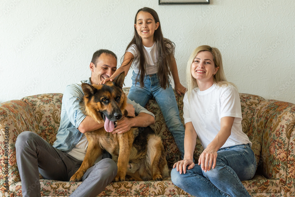 Portrait of happy family with a dog having fun together at home Portrait of happy family with a dog having fun together at home