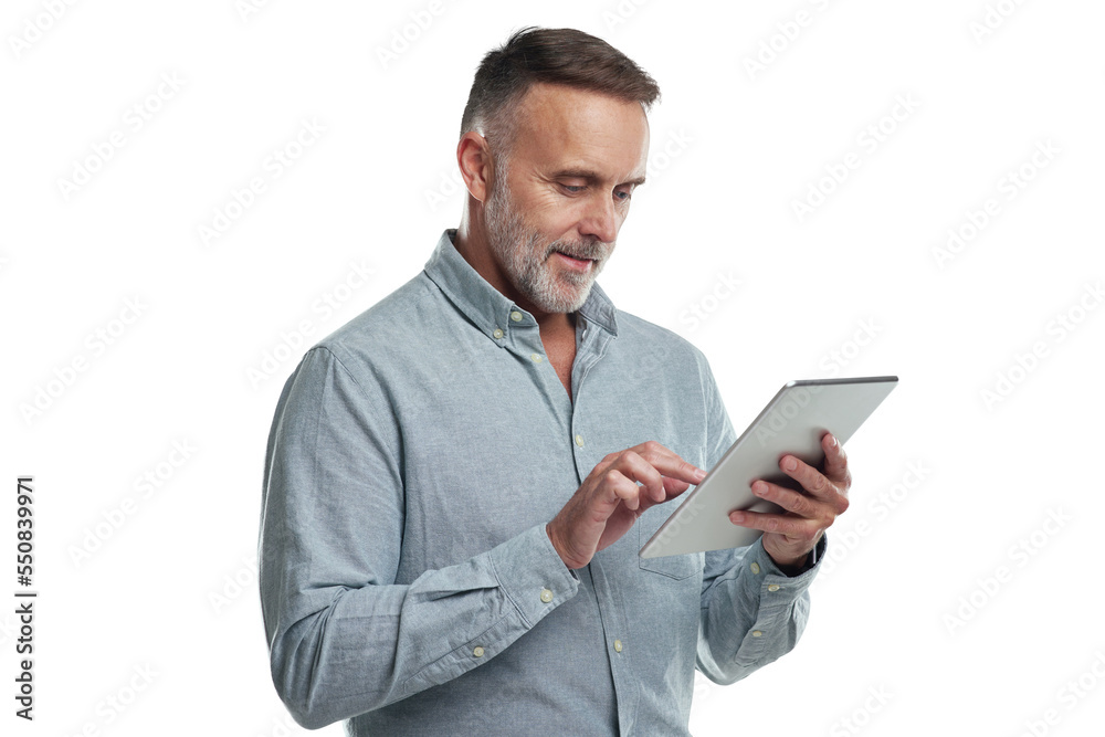 PNG studio shot of a mature man using a digital tablet against a grey background - obrazy, fototapety, plakaty 