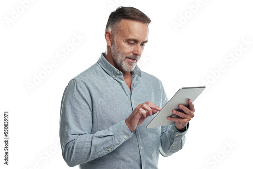 PNG studio shot of a mature man using a digital tablet against a grey background