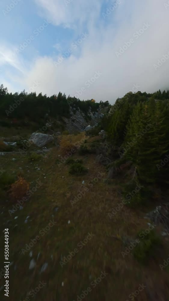 FPV maneuverable flight above the mountain range in Swiss Alps