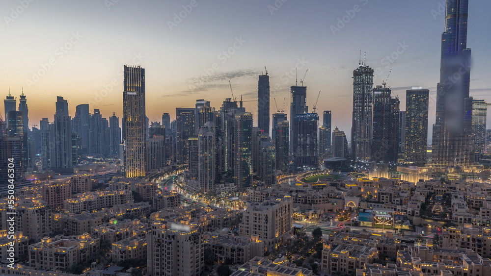 Obraz premium Dubai's business bay towers aerial day to night timelapse. Rooftop view of some skyscrapers