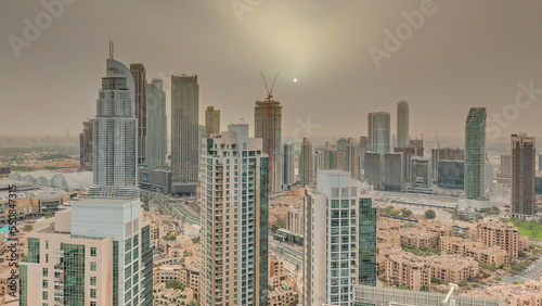 Aerial panoramic sunrise over big futuristic city timelapse. Business bay and Downtown