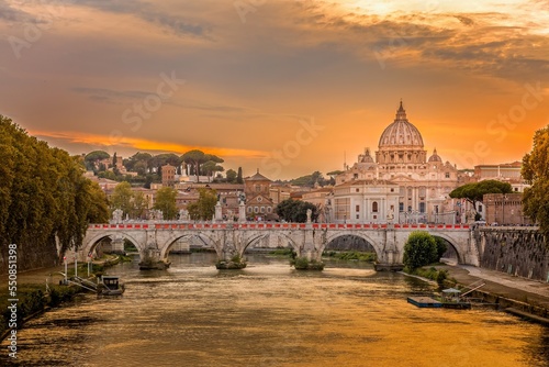 Saint Peter"s Basilica and the Santangelo bridge in the golden eveing light