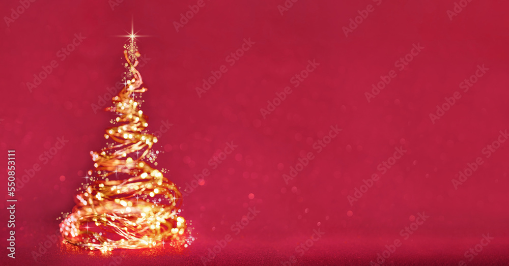 Glowing defocused christmas tree from the golden xmas vivalights on magenta red background banner. Copy space. Merry Christmas or Happy New Year card. Blurred silhouette