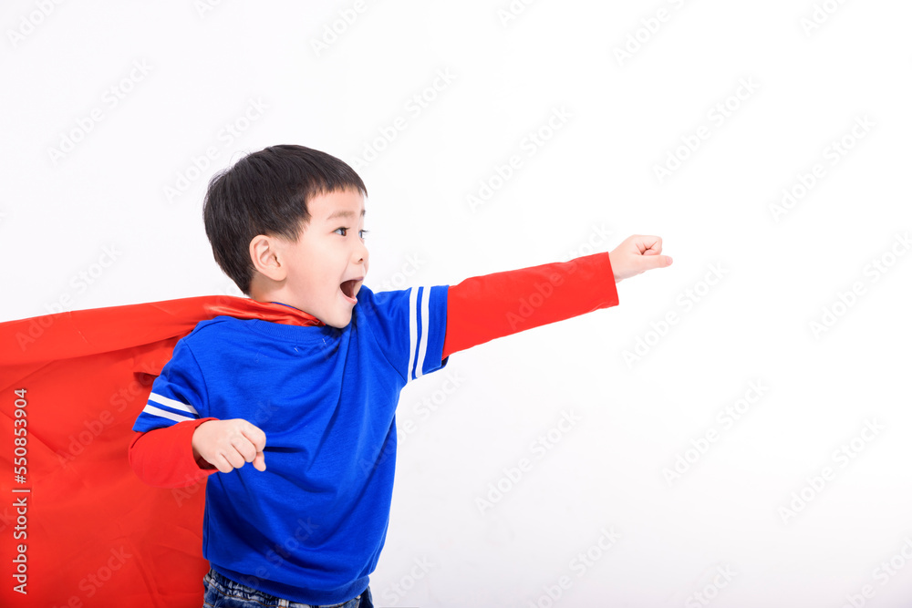 Happy Little boy in red superhero cape and mask Happy Little boy in red superhero cape and mask