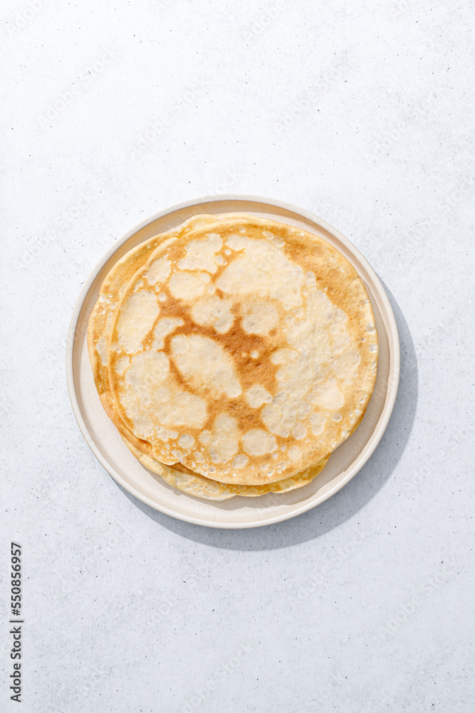 Crepes. Thin crepes on a plate. Top view