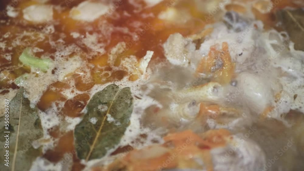 boiling soup from cheap chicken feet, close-up boiling soup from cheap chicken feet, close-up