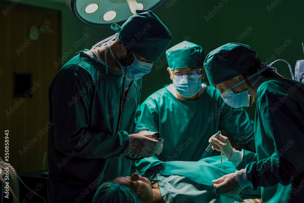A team of professional doctors perform surgery in a hospital, a group of surgeons working in the operating theater. A team of professional doctors perform surgery in a hospital, a group of surgeons working in the operating theater.