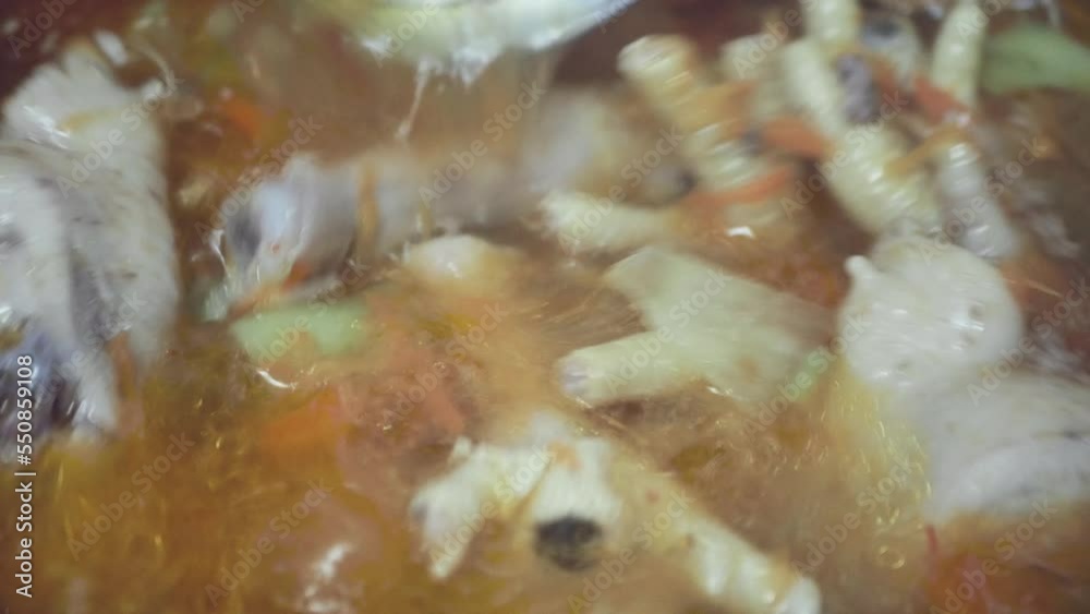 cooking soup from cheap chicken feet, close-up, top view cooking soup from cheap chicken feet, close-up, top view
