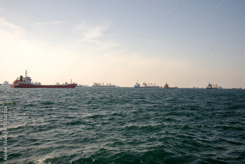There are a lot of merchant ships at sea, a traffic jam from tankers.