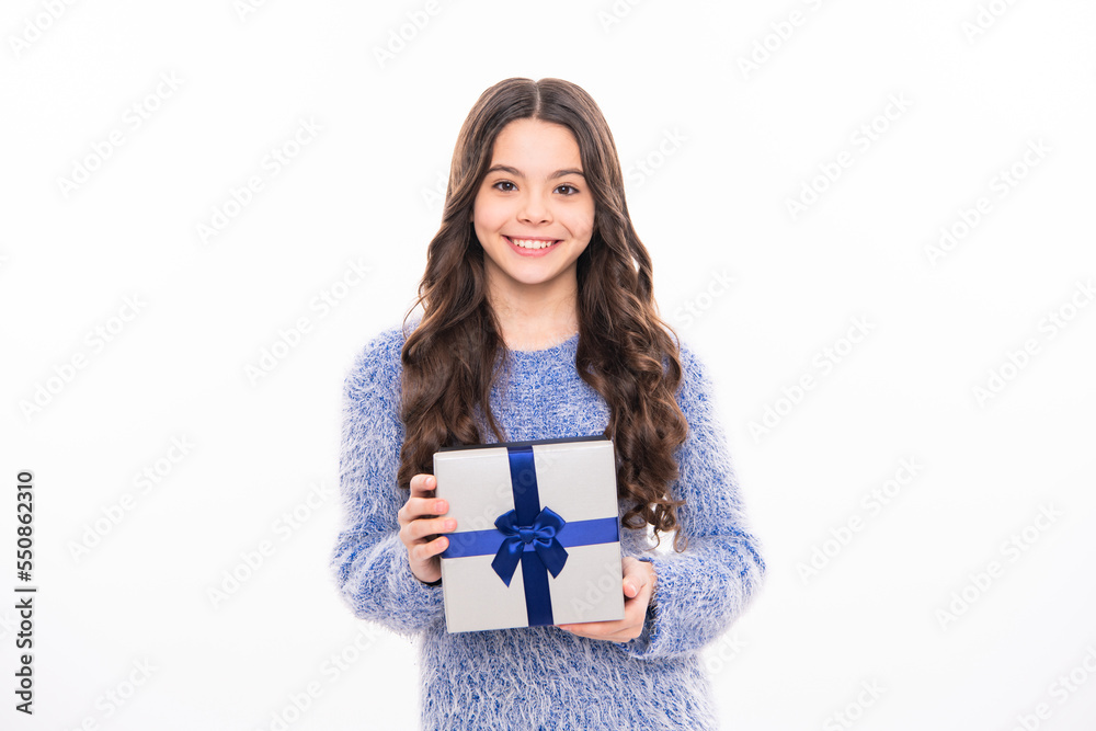 Excited funny kid child girl holding gift box celebrating happy New Year isolated on white background. Teen celebrating birthday. Merry Christmas presents shopping sale. Excited funny kid child girl holding gift box celebrating happy New Year isolated on white background. Teen celebrating birthday. Merry Christmas presents shopping sale.