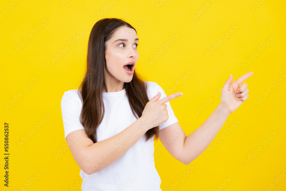 Woman point at copy space, showing copyspace pointing. Promo, girl showing advertisement content gesture, pointing with hand recommend product. Isolated background. Woman point at copy space, showing copyspace pointing. Promo, girl showing advertisement content gesture, pointing with hand recommend product. Isolated background.