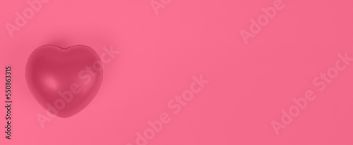 Heart as symbol of love, kindness, charity. Banner with copy space in Viva Magenta color of the year 2023.