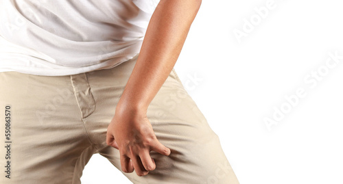 Asian man in reaction of scratching crotch on white background, closeup. Annoying itch or Tinea Cruris. Human body problem or healthcare and medicine concept.