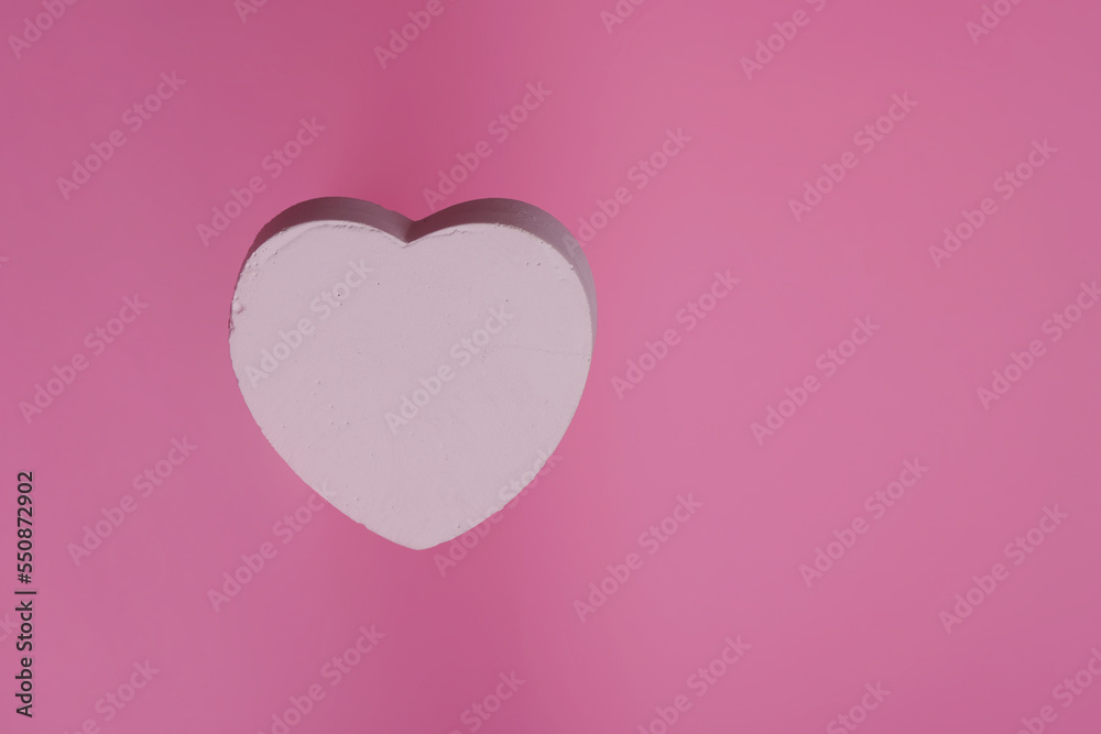 heart shape on pink background, minimalistic greeting card Valentine's day, space for text