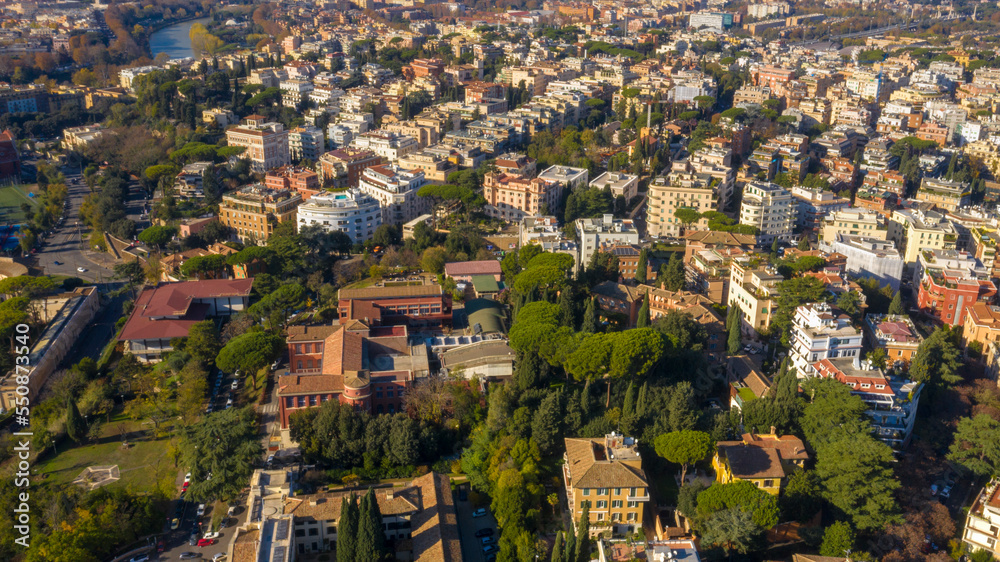 Aerial view over the Tiber River near Parioli district in Rome, Italy. Autumn colors dye the trees along the river.