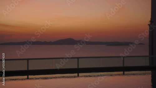 Beautiful sunset in the sea, view from swimming a pool