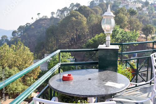 Early morning view of Modern rooftop restaurant at Kasauli  Himachal Pradesh in India  View of mountain hills from open air restaurant in Kasauli  Kasauli Rooftop restaurant