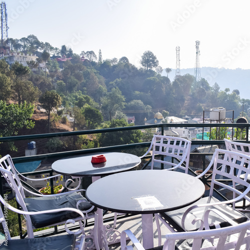 Early morning view of Modern rooftop restaurant at Kasauli  Himachal Pradesh in India  View of mountain hills from open air restaurant in Kasauli  Kasauli Rooftop restaurant