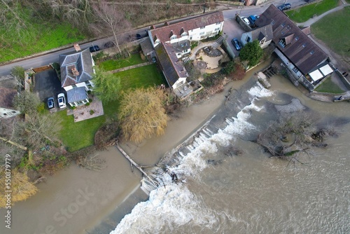 Pub on River Severn near Ironbridge England flooded drone aerial view. photo