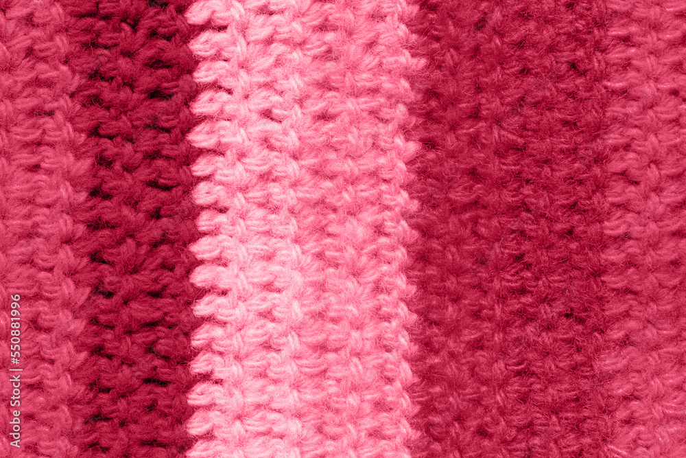 Trendy color of the year 2023. Texture patterned knit fabric toned in viva magenta color Trendy color of the year 2023. Texture patterned knit fabric toned in viva magenta color