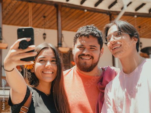 youngsters take a selfie on vacation in cuenca -Ecuador focus on the man in the middle