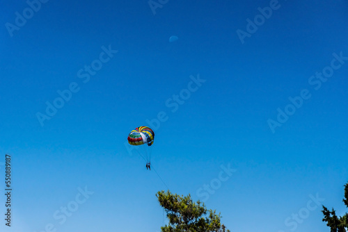 A man parasailing over the bay of Kotor, Montenegro.