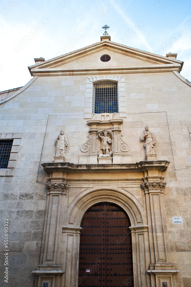 Baroque facade of the Catholic church of San Miguel in Murcia, with sculptures of saints	
