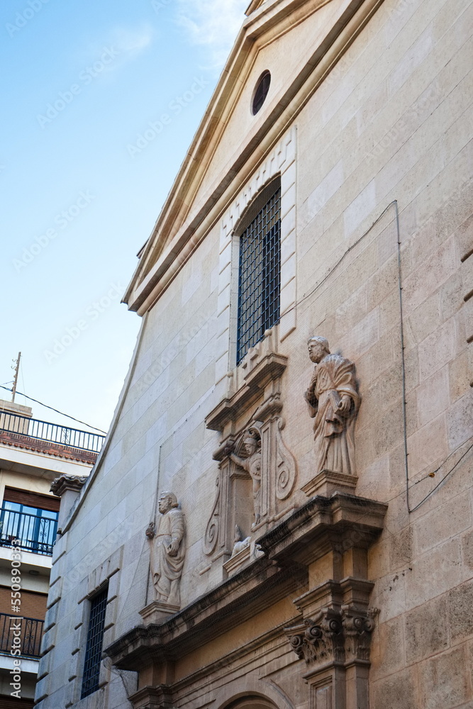 Baroque facade of the Catholic church of San Miguel in Murcia, with sculptures of saints	
