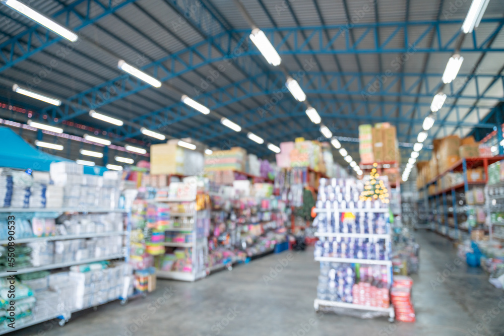 Blurred image Rows of shelves with goods boxes in modern industry warehouse store at  large store or factory warehouse storage. warehouse and export industry background concept.